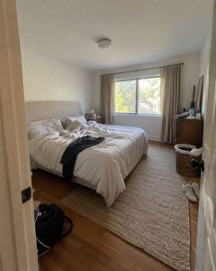 Example phone photo: a messy bedroom with an unmade bed and clothes on the floor